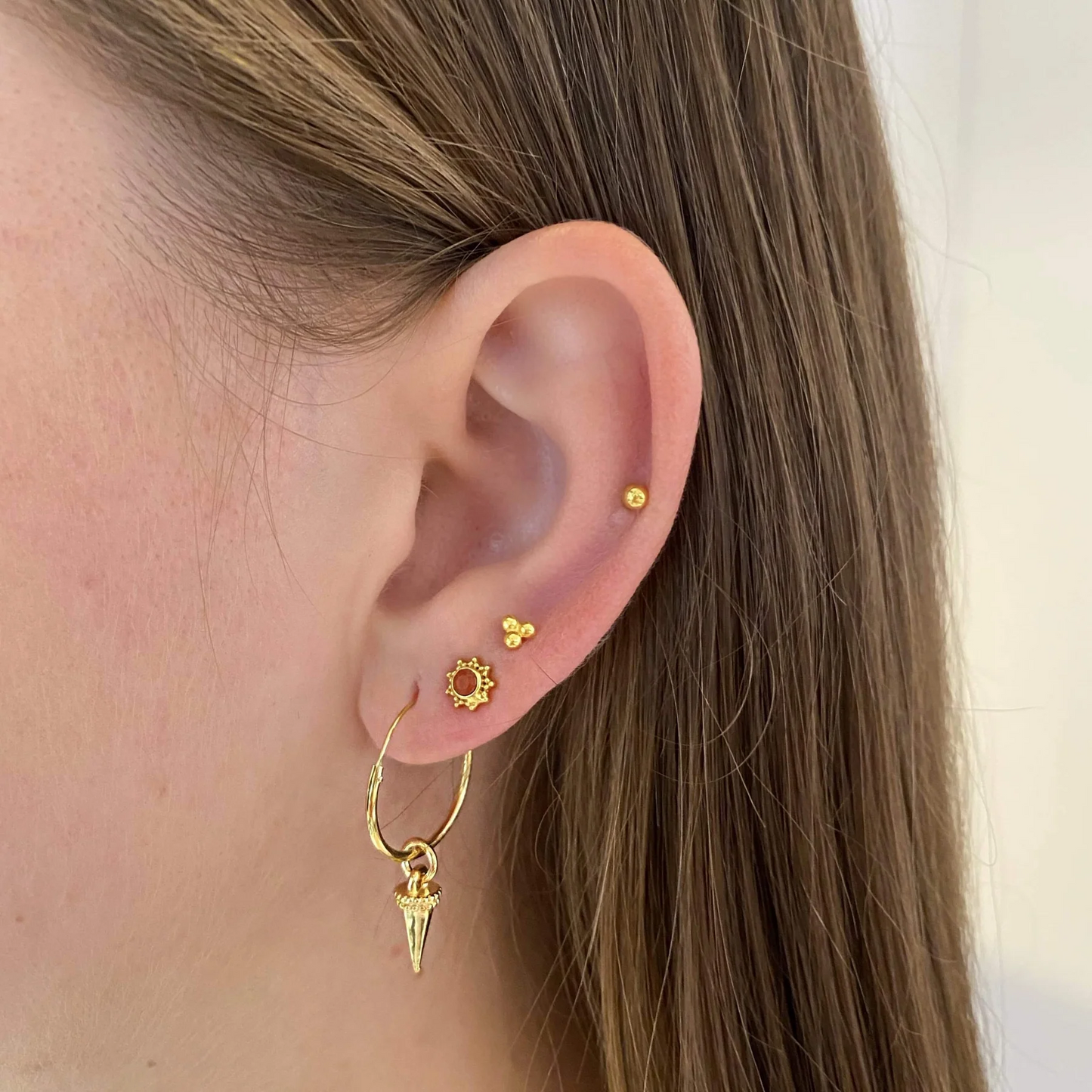 
                  
                    Gold Triple Stud Earring
                  
                