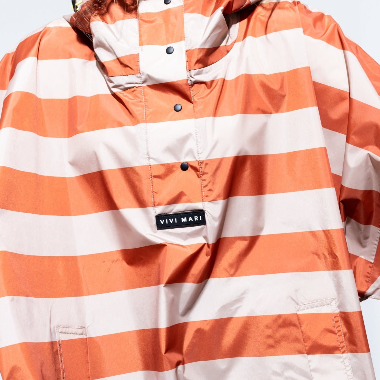 
                  
                    Cinnamon Latte Bold Stripes Raincoat
                  
                