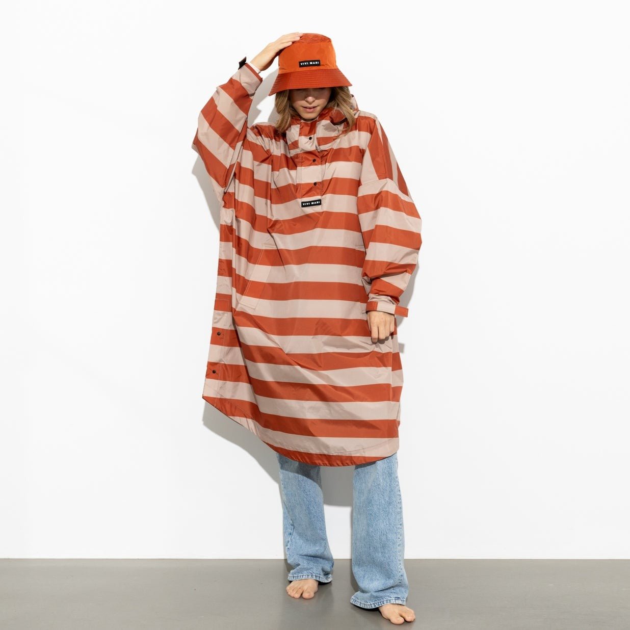 
                  
                    Cinnamon Latte Bold Stripes Raincoat
                  
                