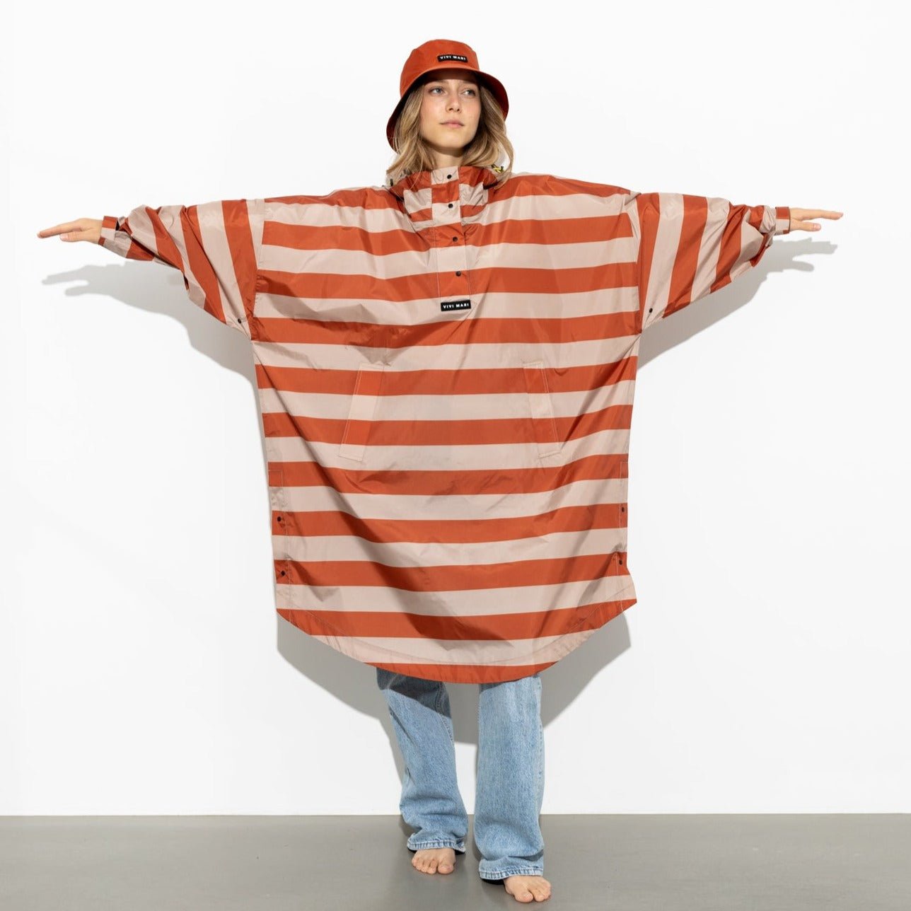 
                  
                    Cinnamon Latte Bold Stripes Raincoat
                  
                