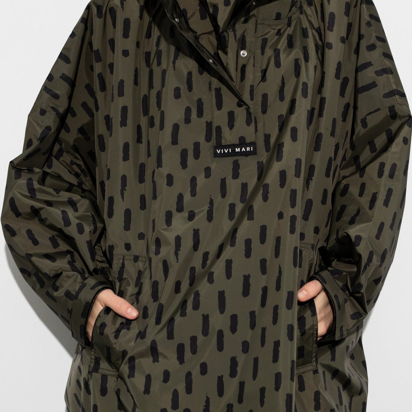 
                  
                    Olive Black Drops Raincoat
                  
                