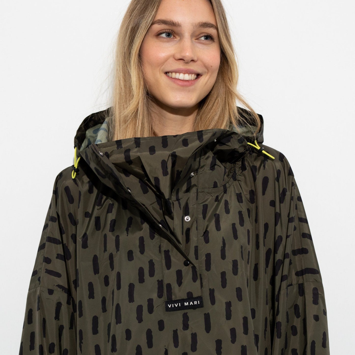 
                  
                    Olive Black Drops Raincoat
                  
                