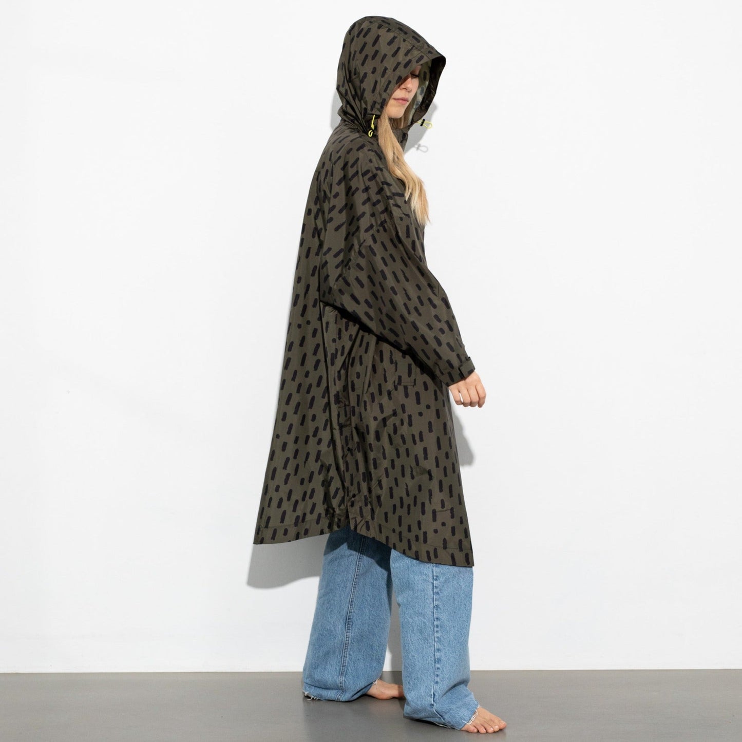 
                  
                    Olive Black Drops Raincoat
                  
                