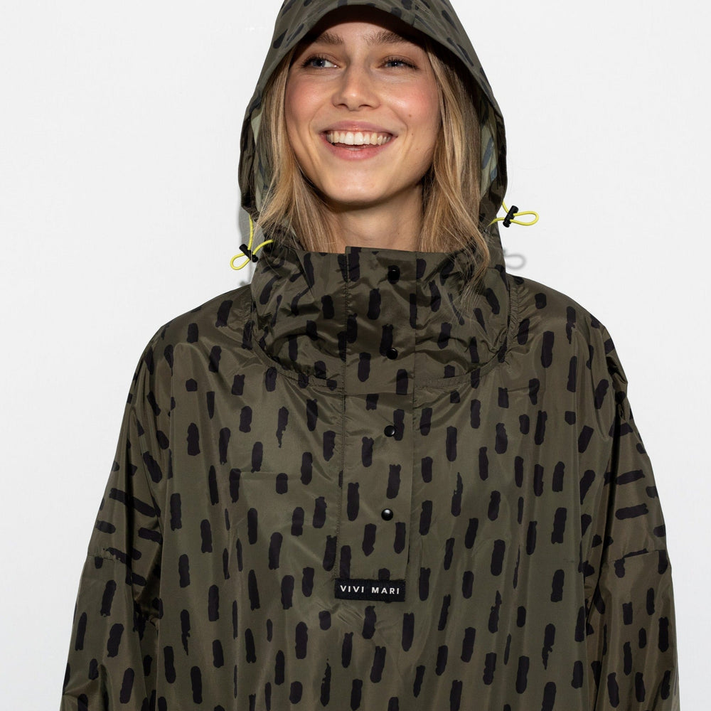 
                  
                    Olive Black Drops Raincoat
                  
                