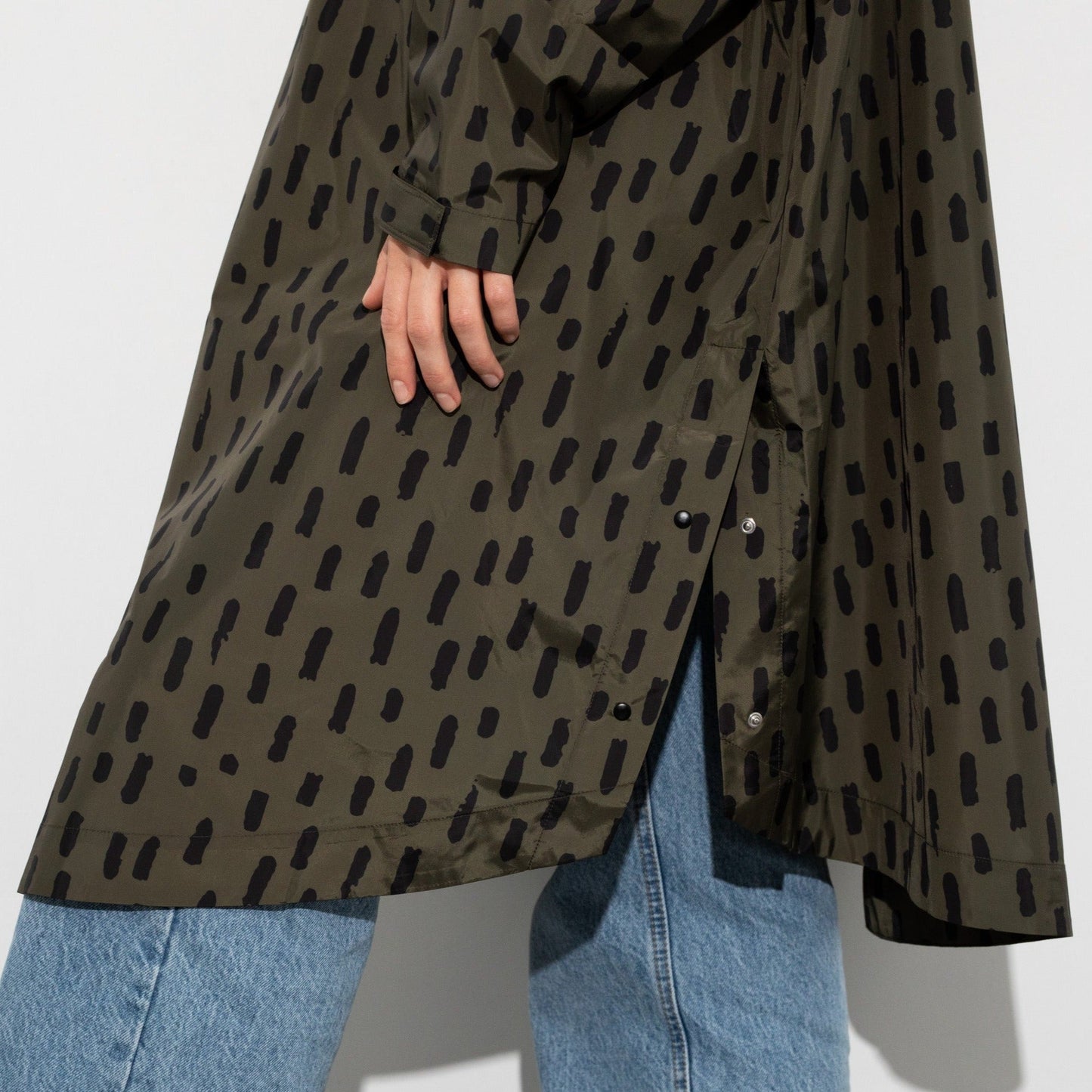 
                  
                    Olive Black Drops Raincoat
                  
                