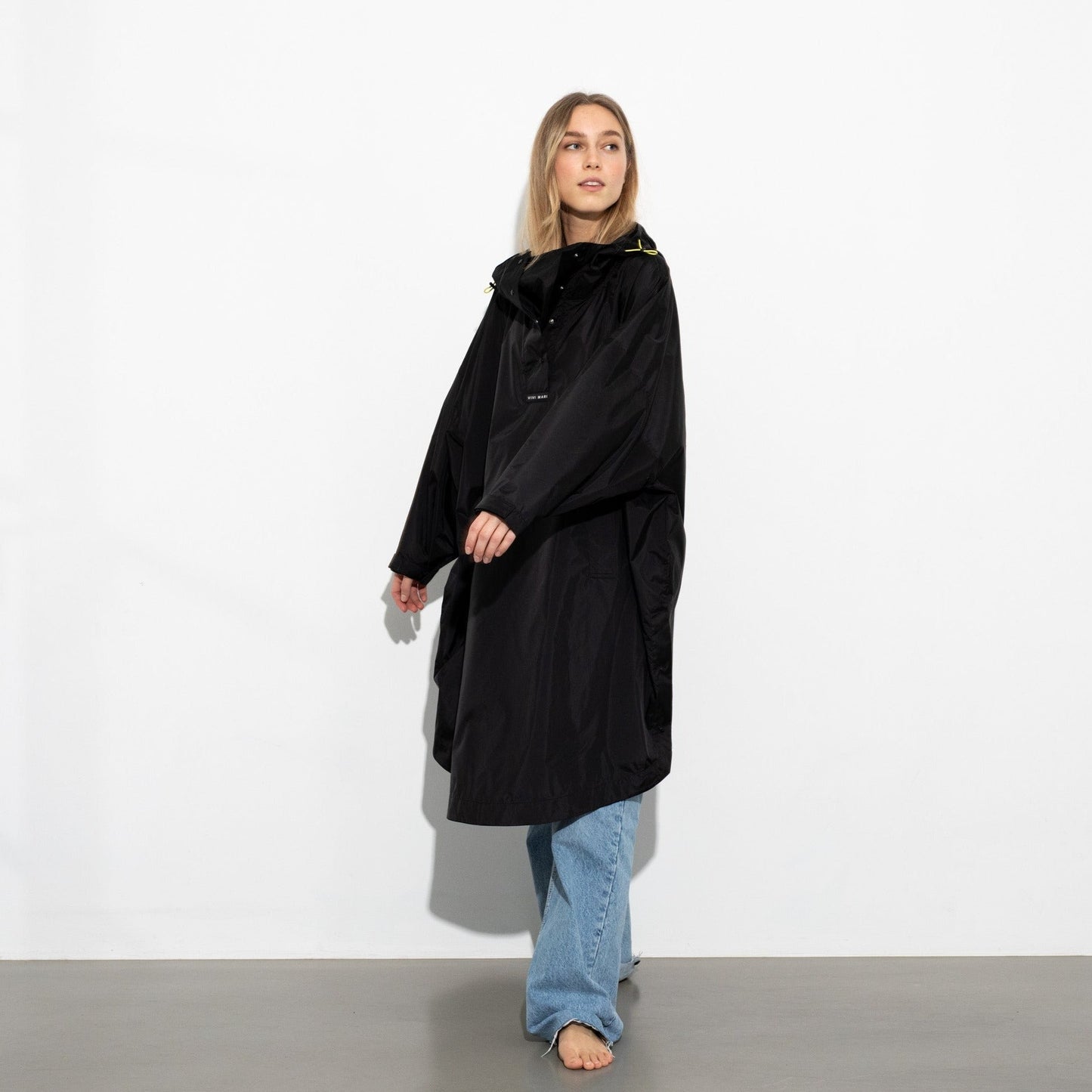 
                  
                    Black Solid Raincoat
                  
                