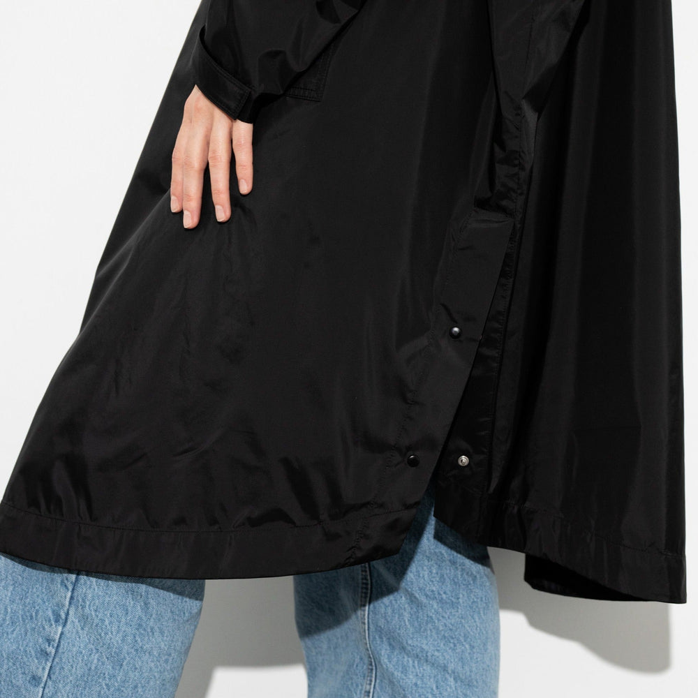 
                  
                    Black Solid Raincoat
                  
                